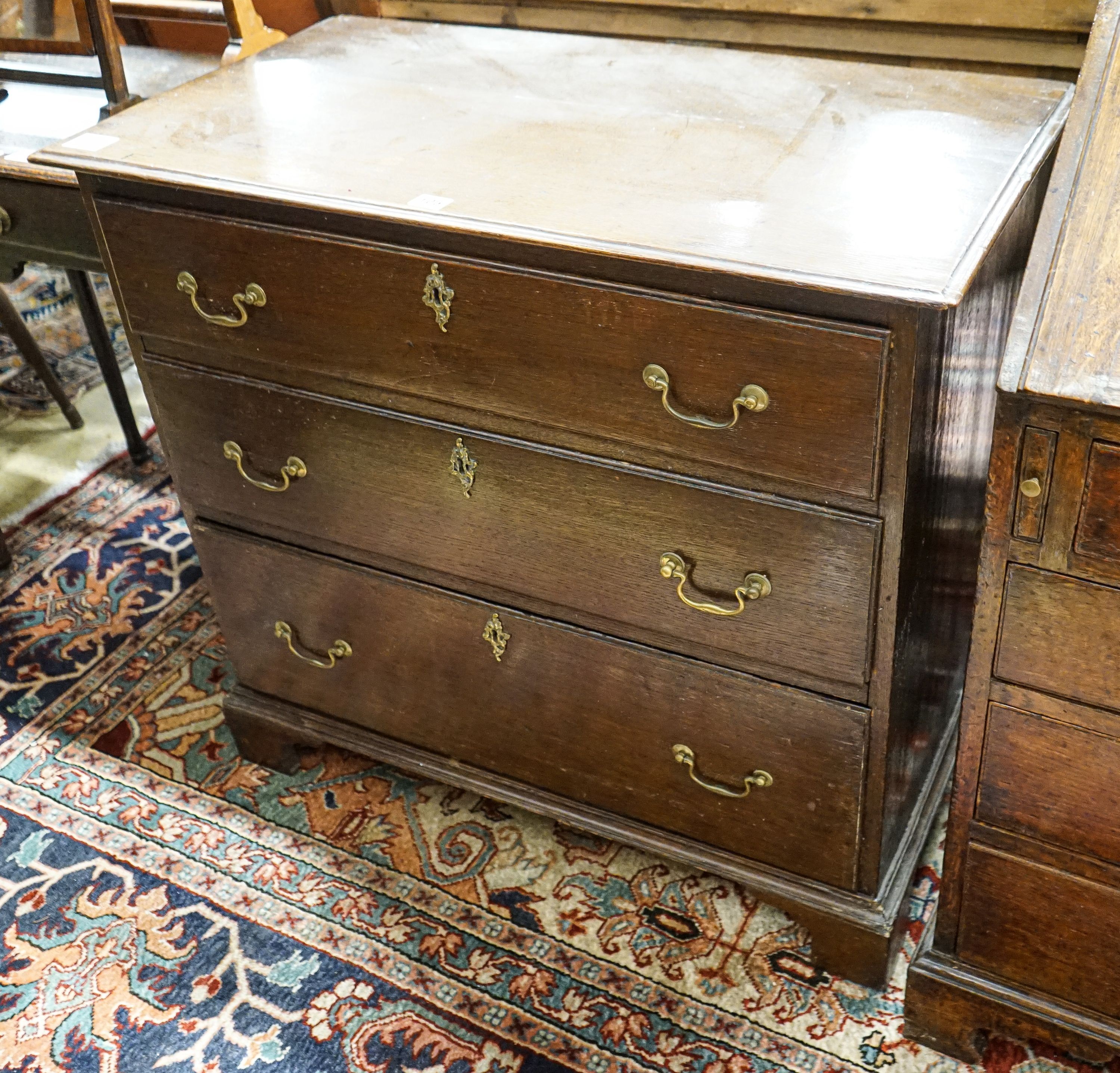 A George III style oak three drawer chest, width 86cm, depth 46cm, height 78cm